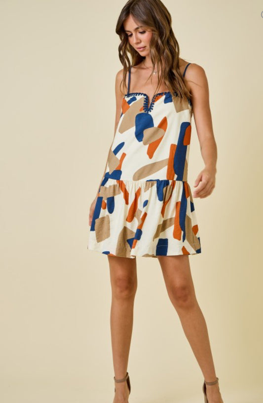 Geometric print dress with knotted edge | cream burnt orange navy