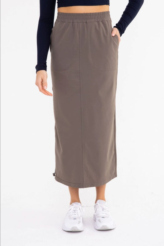 Mono B Olive Cargo Maxi Skirt with adjustable leg reveal feature.
