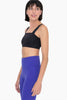 Black sports bra with a modern square neck design by Mono B.