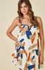 Geometric print dress with knotted edge | cream burnt orange navy