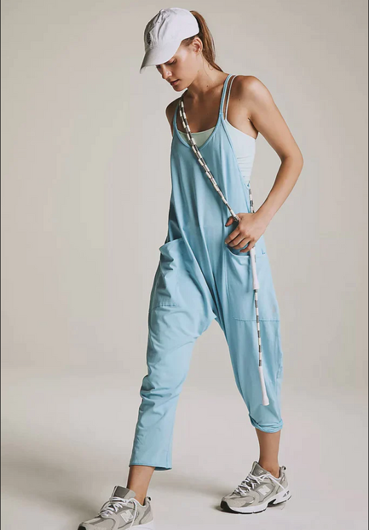 Comfy racerback silhouette onesie with oversized patch pockets by Free People Movement.